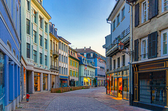 Fototapeta Old town Mulhouse city historic centre with narrow pedestrian street, old colorful buildings, typical multicolored houses, Alsace Grand Est region, France