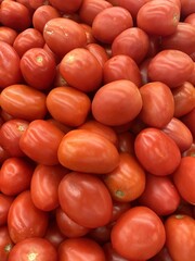 bright red, fresh tomatoes on the market