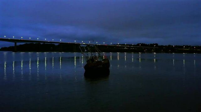Artistic shot of the Foyle Bridge at night. Establishing shot