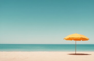 A bright yellow umbrella on a serene beach under a clear blue sky in midday light