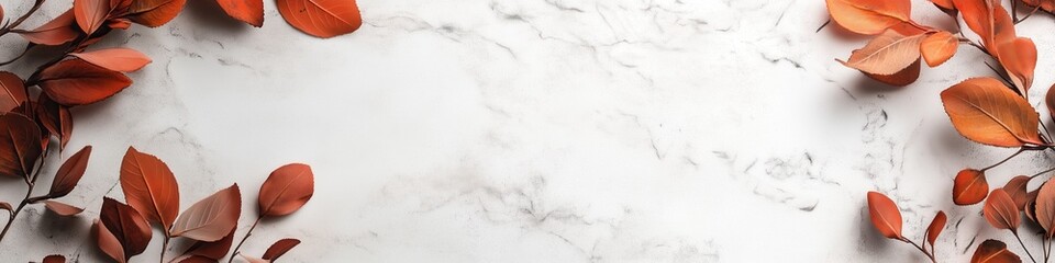 Obraz premium Autumn leaves framing a white marble background
