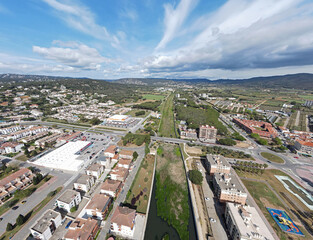 Aerial top down view of river filled with algae bloom in Palamos Catalonia