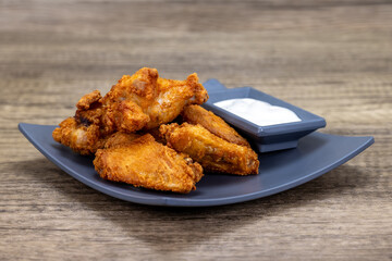 Crispy chicken wings arranged with ranch dipping sauce for a perfect appetizer