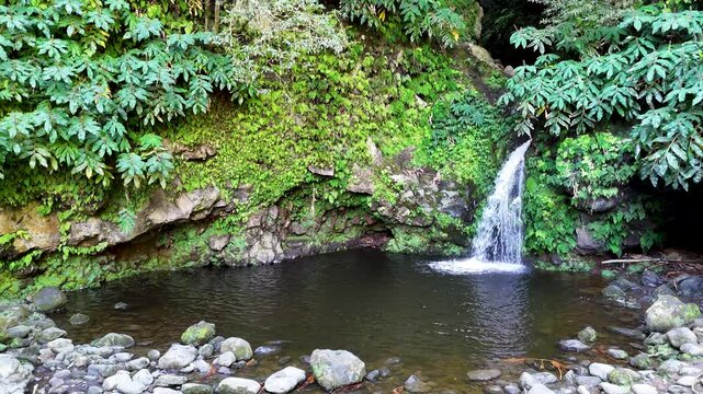 Poco Azul the blue lagoon of the Azores, Sao Miguel, Portugal. Aerial 4K drone video footage of Poco Azul waterfall