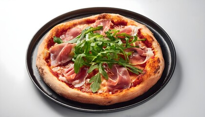 Pizza with prosciutto and arugula black plate isolated white background
