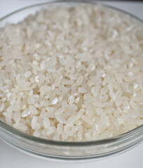 Plate with rice from above. Rice porridge in glass bowl isolated on white background with clipping path, top view