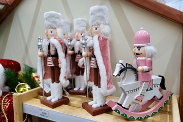 tin soldiers in elegant ceremonial clothes, Christmas figurines, a soldier on a wooden rocking horse