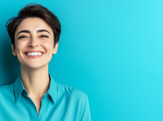 Fototapeta premium Woman smiling isolated on a blue background