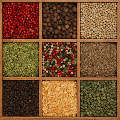 Wooden box of assorted spices