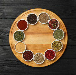 Circle of assorted spices in bowls