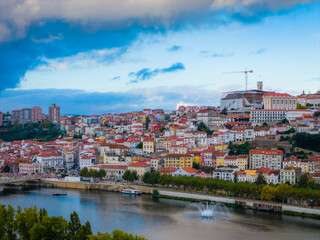 Obraz premium Aerial view of Coimbra city old town on the hill. Panoramic drone cityscape and Mondego River, Portugal