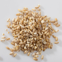 Pearl barley on a white surface, macro