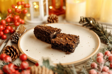 Festive Christmas brownie surrounded by holiday decorations, creating a cozy holiday vibe. Perfect for holiday season themes, Christmas treats, festive dessert spreads, and holiday celebration visuals