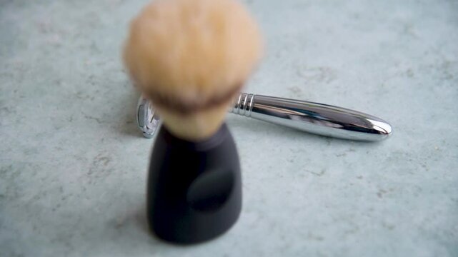 a brush and a T-shaped razor