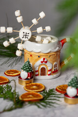 Cute marshmallow snowflake in christmas cup with cocao on the table new year fun dessert