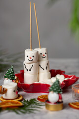 Cute two marshmallow snowman on dark background christmas fun dessert