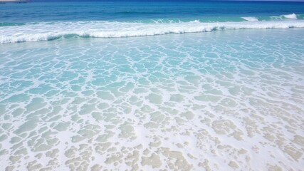 Pure blue turquoise water with foamy waves, perfect for beach vacation backgrounds or tropical paradise concepts, tropical, turquoise