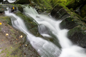 Long exposure of a waterfall on the Hoar Oak Water river at Watersmeet in Exmoor National Park