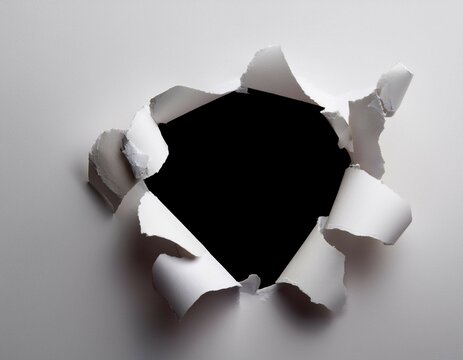 torn white surface with a hole in the center