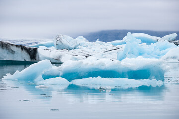 Icebergs swimming on Jokulsarlon glacier lagoon in Iceland