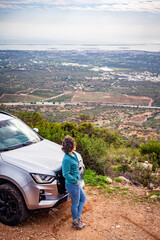 woman on the road with off road 4x4 car