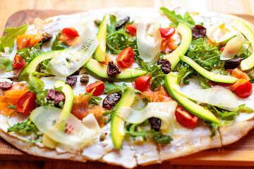 closeup of flatbread style pizza