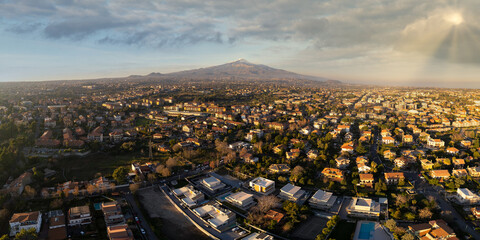 Aerial View of Catania City with the Majestic Mount Etna Volcano in the Background — Stunning Panorama of Sicilian Urban Landscape and Iconic Volcanic Scenery at Sunset