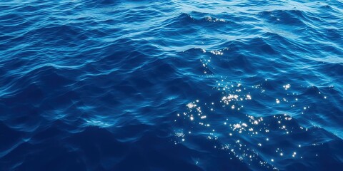 Obraz premium Rippling deep blue sea texture with sunlight reflections, texture, sea
