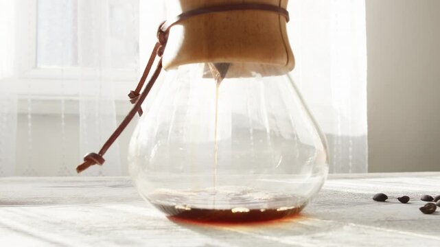 brewing coffee with coffee wooden dripper in close-up