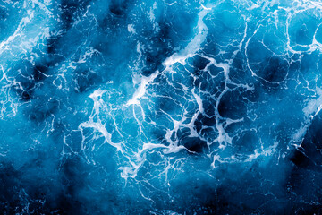 Ocean water texture. Top view of elegant water with foam. Can be used in covers, packaging, posters, textures, presentations, art, and design projects. Breathtaking nature background image.