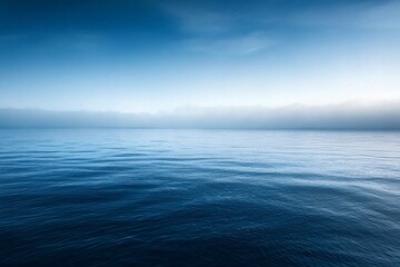 Fototapeta premium Tranquil Ocean Horizon: Serenity of Blue Waters Under a Calm Sky