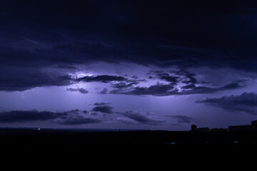 lightning in the night sky over the city