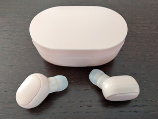 Pink wireless earbuds 