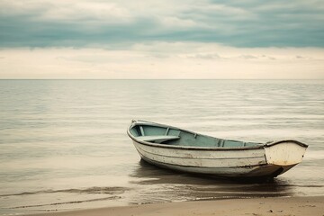 Naklejka premium Serenity on the Shore: A Lone Boat at the Water's Edge
