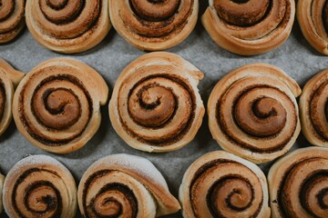 Close-up cinnabons bun freshly baked in the oven before applying cream in a cafe