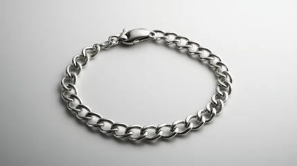 Obraz premium A silver chain bracelet on a white background.