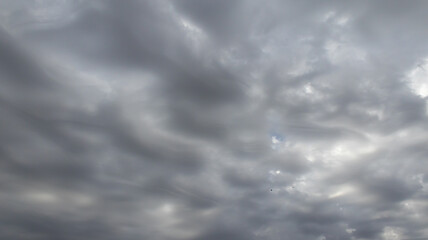 Beautiful dark dramatic sky with stormy clouds before rain or snow. Thunderstorm heaven landscape. Timelapse. High quality photo