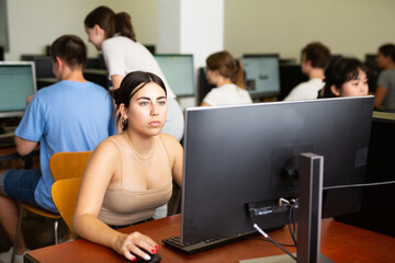 Teenager girl using computer during computer sciene lesson in school.