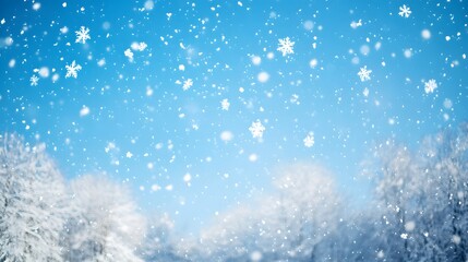 Fototapeta premium Snowflakes Falling on a Blue Sky with Blurred Trees in the Background