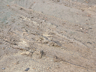 dirt road with mud and dirt in the background