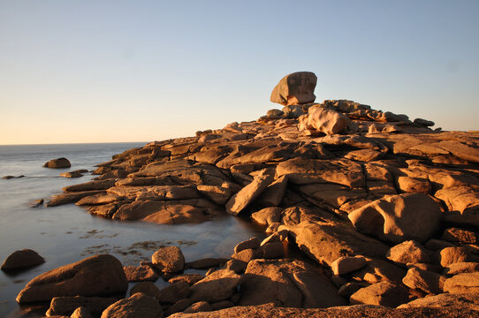 Pink granite rocks at the coast in Brittany , France 