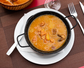 Appetizing beef stew served with potatoes and mushrooms on platter