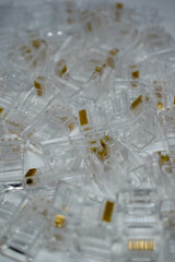Stack of RJ-45 network connectors. Network concept. Background, selective focus
