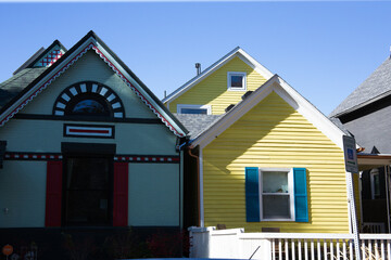 Two starkly different houses beside eachother