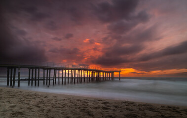 Fototapeta premium Dramatic sunrise over Ocean Grove pier