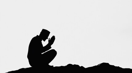 Silhouette of a Person in Prayer on a Rocky Surface Against a White Background, Expressing Contemplation, Reverence, and Spiritual Connection with Nature