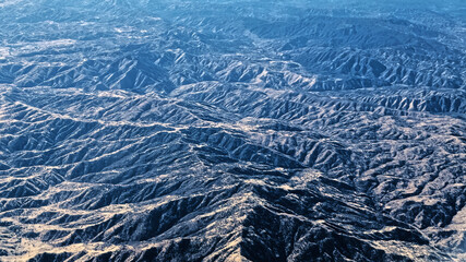 Rock Mountain Landscape Aerial View Looking Down from the Airplane Window.