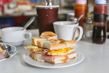 Breakfast Sandwich Perfection: Ham, Egg, and Toast Delight