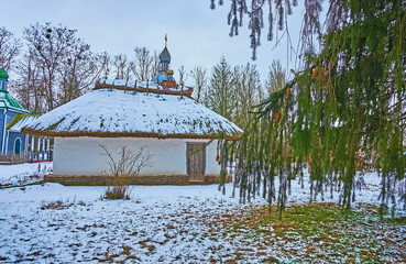 The old adobe priest  house behind the spruce branch, Pereiaslav Scansen, Ukraine