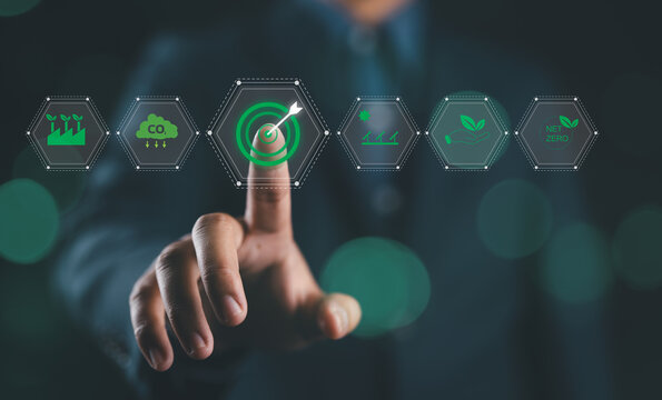 Sustainability and Green Energy concept. Man with icons represent green energy, sustainability, environmental conservation, modern eco-friendly technology. Carbon footprint, target sustainability,